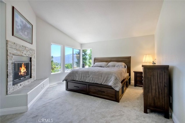 32197 Callesito Fadrique, Temecula, CA 92592 - bedroom with vaulted ceiling, light carpet, and a stone fireplace