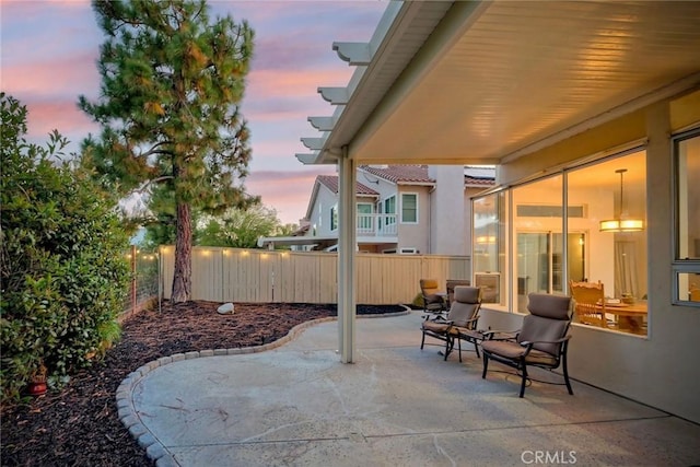 32197 Callesito Fadrique, Temecula, CA 92592 - patio terrace at dusk featuring a patio area and a fenced backyard