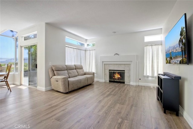 32197 Callesito Fadrique, Temecula, CA 92592 - living area featuring wood finished floors and a tiled fireplace