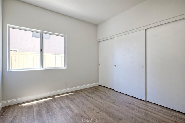 32197 Callesito Fadrique, Temecula, CA 92592 - unfurnished bedroom with wood finished floors and a closet