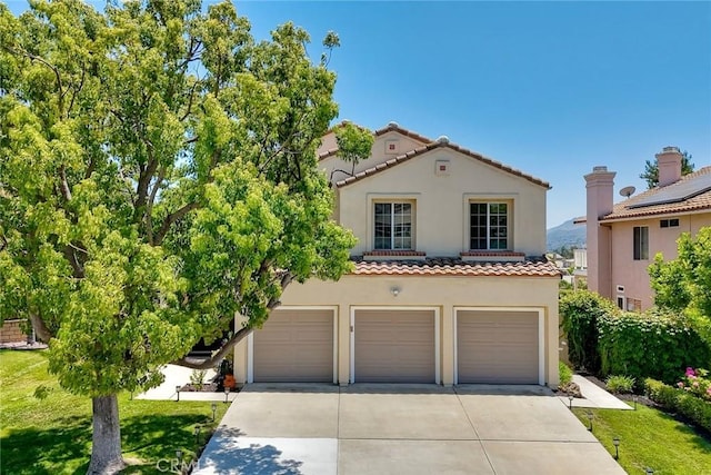 32197 Callesito Fadrique, Temecula, CA 92592 - mediterranean / spanish home with a tile roof, stucco siding, driveway, and an attached garage