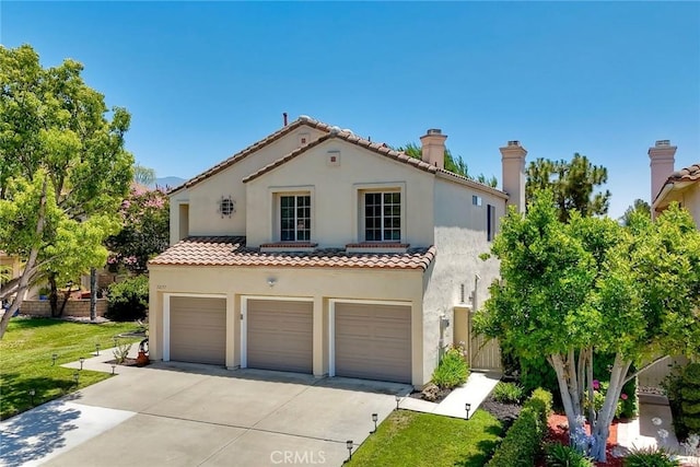32197 Callesito Fadrique, Temecula, CA 92592 - mediterranean / spanish home with a garage, driveway, stucco siding, a tile roof, and a front lawn
