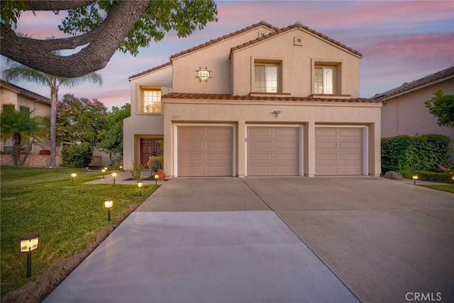 32197 Callesito Fadrique, Temecula, CA 92592 - mediterranean / spanish-style house with concrete driveway, an attached garage, stucco siding, a lawn, and a tile roof