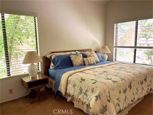 27821 Peninsula Dr, Lake Arrowhead, CA 92352 - carpeted bedroom featuring multiple windows