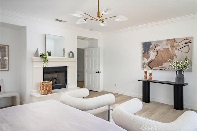 29125 Starwood Pl, Saugus, CA 91390 - bedroom with wood finished floors, crown molding, a chandelier, and a fireplace with raised hearth