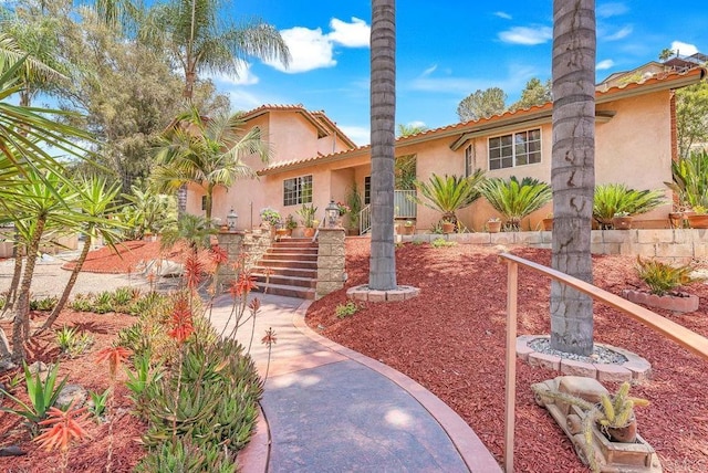1153 Merritt Dr, El Cajon, CA 92020 - mediterranean / spanish-style home featuring stucco siding, stairway, and a tile roof