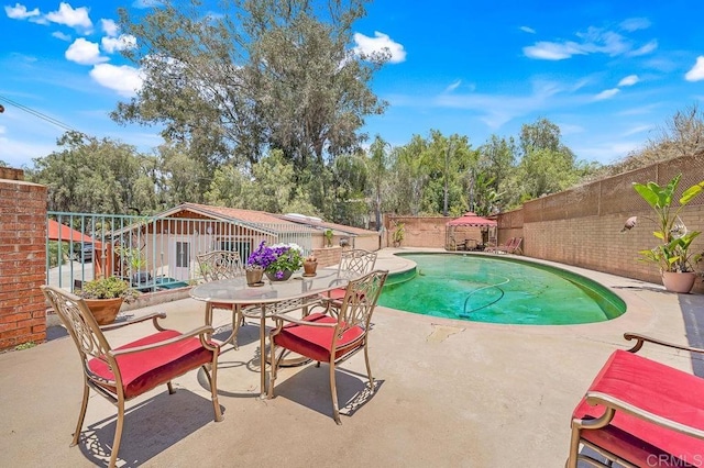 1153 Merritt Dr, El Cajon, CA 92020 - view of swimming pool featuring a patio and a fenced backyard