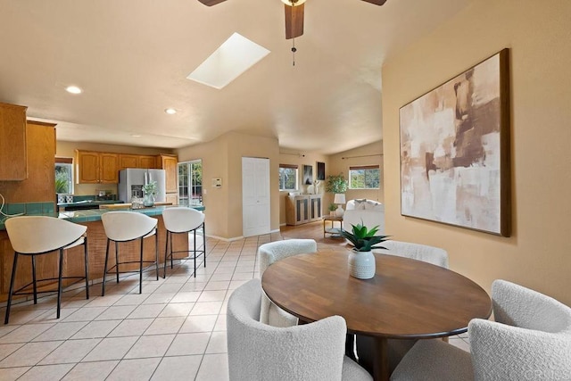 1153 Merritt Dr, El Cajon, CA 92020 - dining space featuring ceiling fan, recessed lighting, plenty of natural light, light tile patterned floors, and a skylight