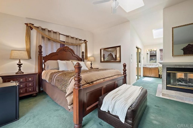 1153 Merritt Dr, El Cajon, CA 92020 - carpeted bedroom with a skylight, a multi sided fireplace, ensuite bath, and ceiling fan