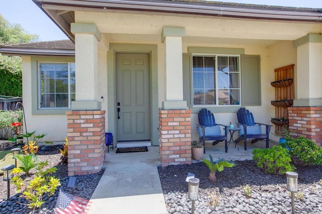 888 Arvita Ct, Oceanside, CA 92057 - property entrance featuring brick siding, stucco siding, and a porch