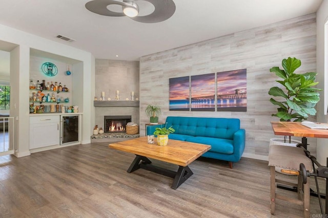 888 Arvita Ct, Oceanside, CA 92057 - living room featuring beverage cooler, a bar, a ceiling fan, and wood finished floors