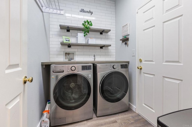 888 Arvita Ct, Oceanside, CA 92057 - laundry area featuring washing machine and clothes dryer and wood finished floors