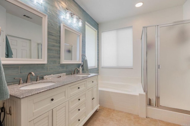 888 Arvita Ct, Oceanside, CA 92057 - bathroom featuring double vanity, a shower stall, a garden tub, and tile patterned floors