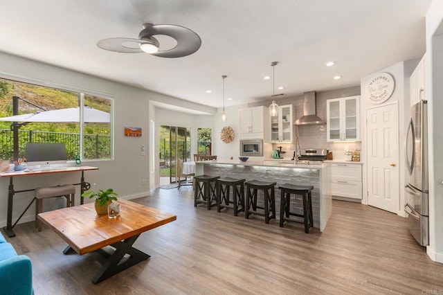 888 Arvita Ct, Oceanside, CA 92057 - living area featuring ceiling fan, wood finished floors, and recessed lighting