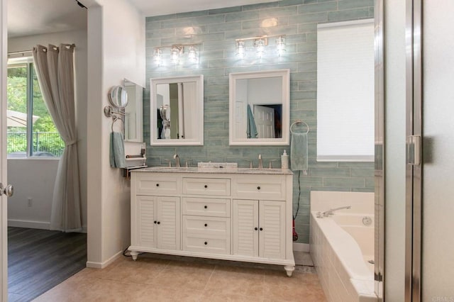 888 Arvita Ct, Oceanside, CA 92057 - bathroom with double vanity, a garden tub, and tile patterned floors