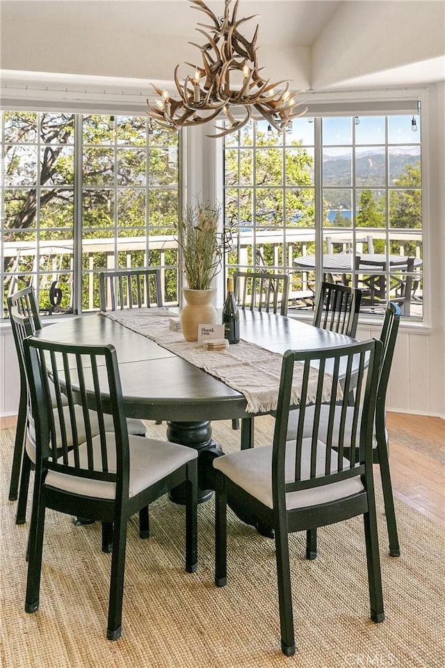 915 Breithorn Dr, Lake Arrowhead, CA 92352 - sunroom / solarium featuring a chandelier and plenty of natural light