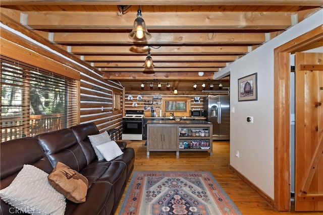 788 Buckingham Sq, Lake Arrowhead, CA 92352 - living room featuring wood finished floors, beamed ceiling, and log walls