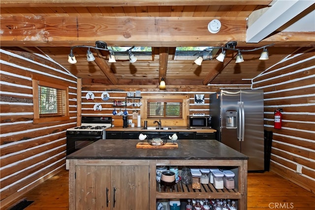 788 Buckingham Sq, Lake Arrowhead, CA 92352 - kitchen featuring stainless steel fridge, black range with gas cooktop, hardwood / wood-style floors, wood ceiling, and a center island