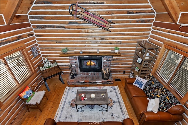 788 Buckingham Sq, Lake Arrowhead, CA 92352 - living room featuring hardwood / wood-style flooring, rustic walls, and a fireplace