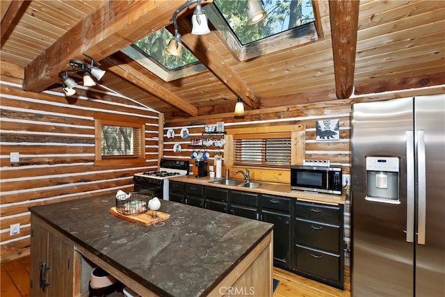 788 Buckingham Sq, Lake Arrowhead, CA 92352 - kitchen with appliances with stainless steel finishes, log walls, a skylight, wood ceiling, and dark cabinets