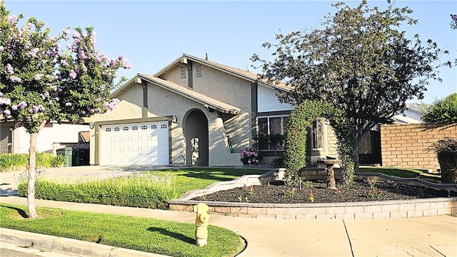 22361 Raven Way, Grand Terrace, CA 92313 - view of front of house featuring a garage, stucco siding, and concrete driveway