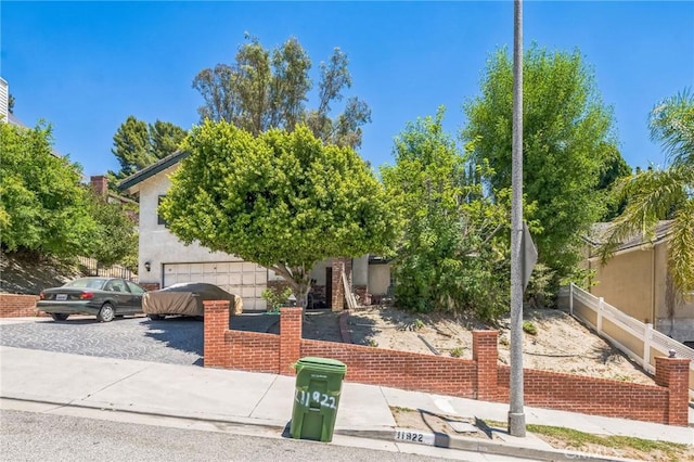 11922 Louise Ave, Granada Hills, CA 91344 - obstructed view of property featuring a garage
