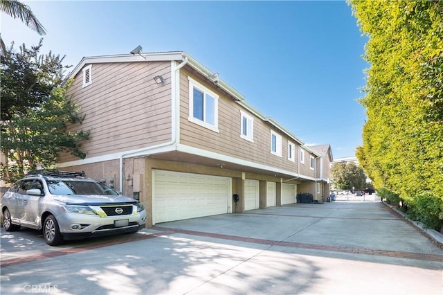 9228 Elm Vista Dr Unit B, Downey, CA 90242 - view of property exterior with a garage and driveway