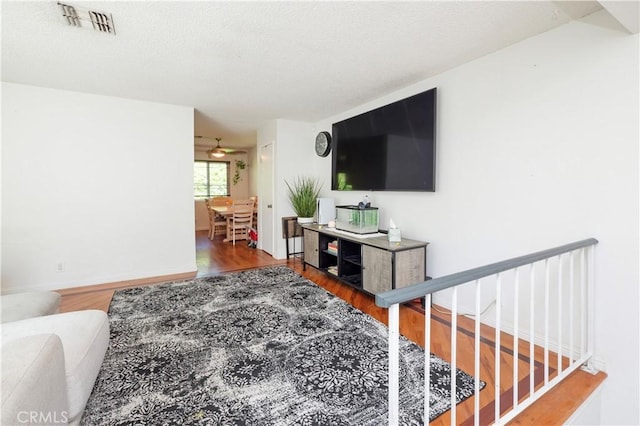 9228 Elm Vista Dr Unit B, Downey, CA 90242 - living room with wood finished floors and a textured ceiling