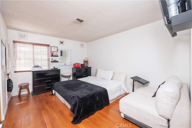 9228 Elm Vista Dr Unit B, Downey, CA 90242 - bedroom with wood finished floors and a textured ceiling