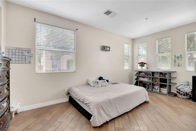 434 Sonora Cir, Redlands, CA 92373 - bedroom with light wood finished floors and baseboards