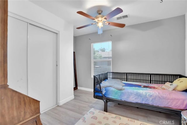 434 Sonora Cir, Redlands, CA 92373 - bedroom featuring light wood finished floors, a closet, and ceiling fan