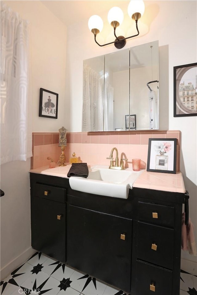 8220 Owens St, Sunland, CA 91040 - bathroom with vanity, a chandelier, and decorative backsplash