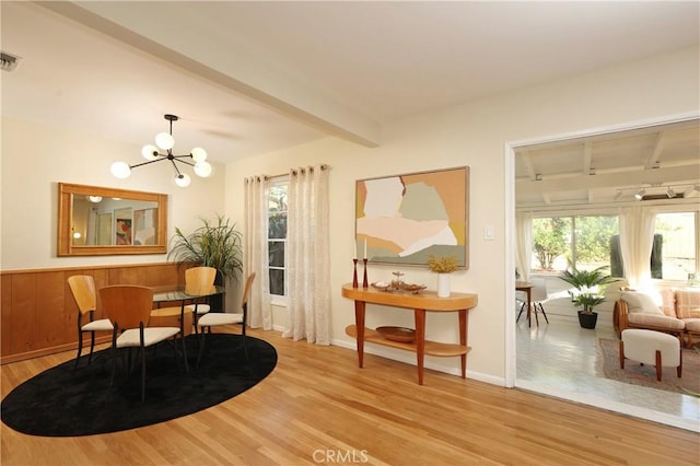 8220 Owens St, Sunland, CA 91040 - living area featuring beamed ceiling, healthy amount of natural light, wood finished floors, and a chandelier