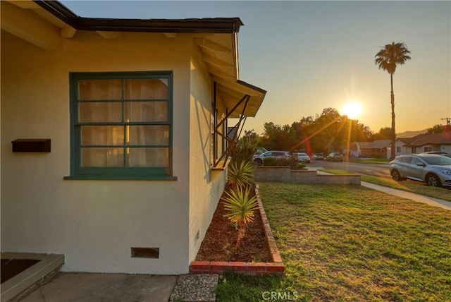 8220 Owens St, Sunland, CA 91040 - view of side of home featuring stucco siding, a yard, and crawl space
