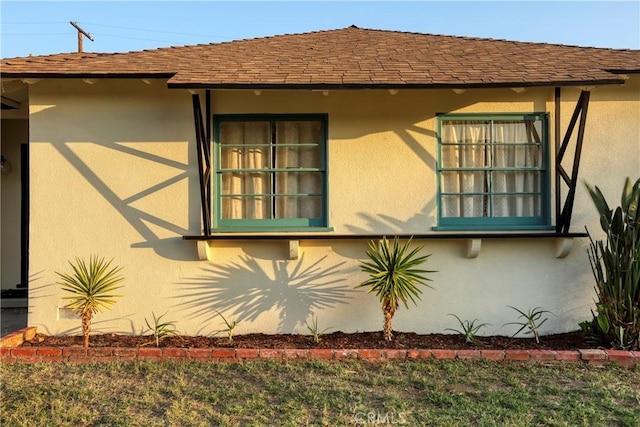 8220 Owens St, Sunland, CA 91040 - view of side of property featuring stucco siding and roof with shingles