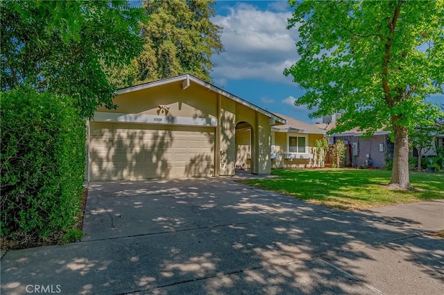 2950 Marie Ln, Merced, CA 95340 - view of front of home with driveway, a garage, a front yard, and stucco siding