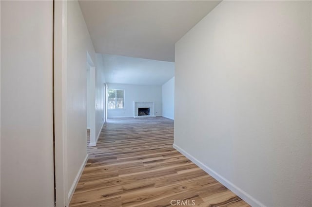 2950 Marie Ln, Merced, CA 95340 - corridor featuring light wood-style flooring and vaulted ceiling