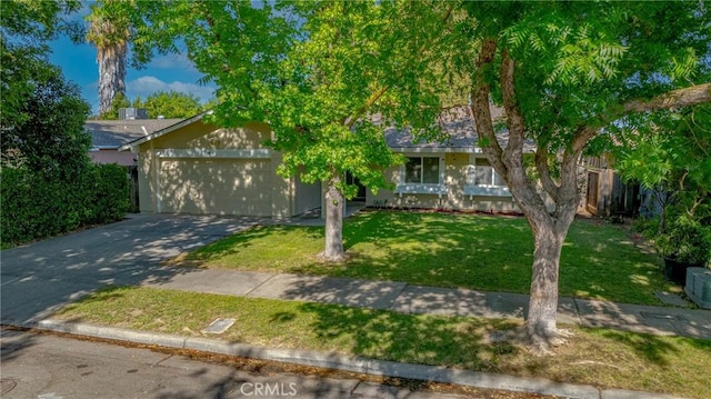 2950 Marie Ln, Merced, CA 95340 - obstructed view of property featuring driveway, a garage, and a front yard