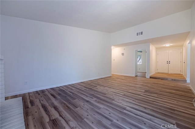 2950 Marie Ln, Merced, CA 95340 - unfurnished living room featuring wood finished floors and baseboards