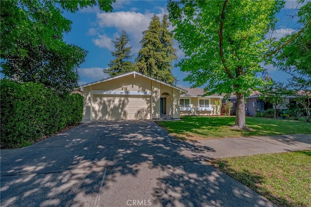 2950 Marie Ln, Merced, CA 95340 - ranch-style house with driveway, a garage, and a front yard