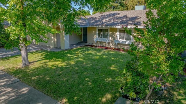 2950 Marie Ln, Merced, CA 95340 - ranch-style home featuring a front yard, stucco siding, and a shingled roof