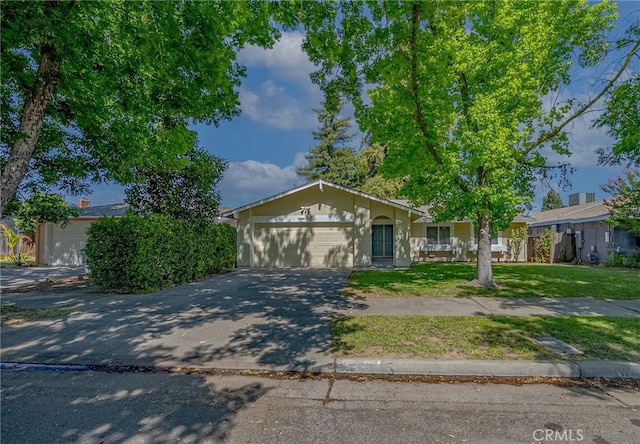 2950 Marie Ln, Merced, CA 95340 - view of front of home featuring driveway, a garage, and a front yard