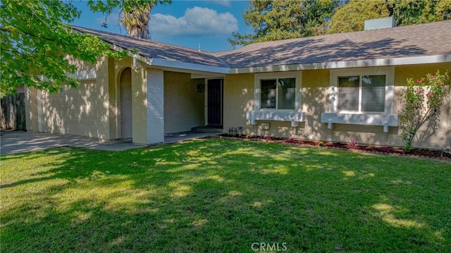2950 Marie Ln, Merced, CA 95340 - ranch-style home featuring stucco siding, a front yard, and an attached garage