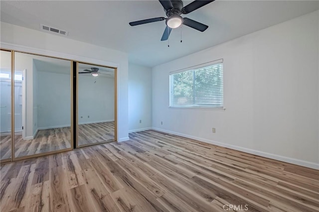 2950 Marie Ln, Merced, CA 95340 - unfurnished bedroom with wood finished floors, a closet, and ceiling fan