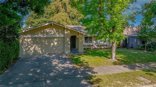 2950 Marie Ln, Merced, CA 95340 - single story home featuring an attached garage, driveway, a front lawn, and stucco siding