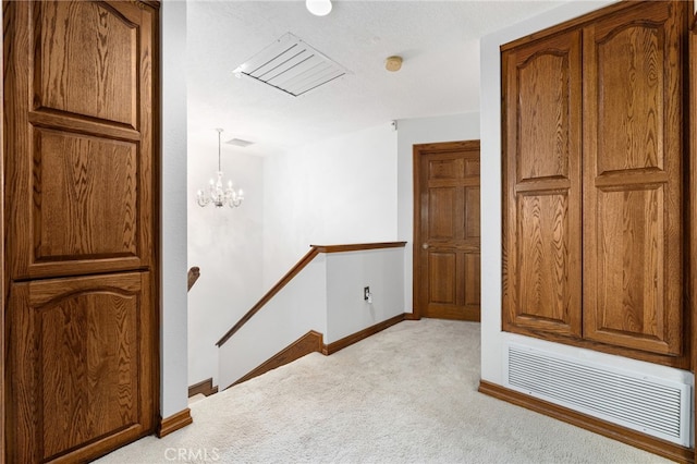 981 Deep Springs Dr, Claremont, CA 91711 - corridor with an upstairs landing, light colored carpet, and a chandelier