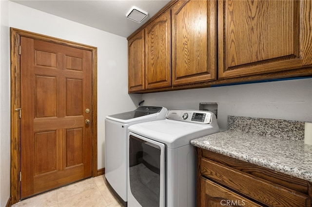 981 Deep Springs Dr, Claremont, CA 91711 - washroom featuring cabinet space, washer and clothes dryer, and light tile patterned flooring