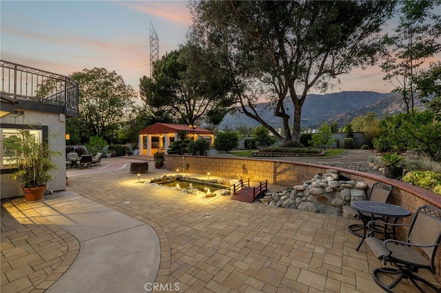 981 Deep Springs Dr, Claremont, CA 91711 - patio / terrace with an outdoor fire pit, a patio, and a mountain view