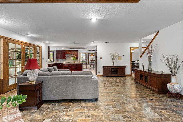 981 Deep Springs Dr, Claremont, CA 91711 - living room with stone finish floors and a textured ceiling