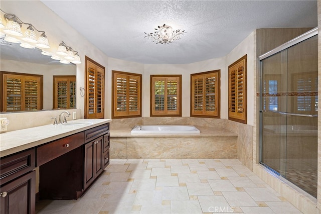 981 Deep Springs Dr, Claremont, CA 91711 - full bathroom with vanity, a bath, a stall shower, and a textured ceiling